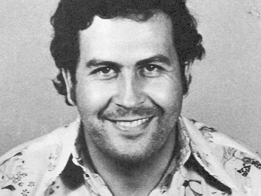 this is a picture of Pablo Escobar. Oval face and nice smile. this is the most popular picture of him. Leader of Medellín Cartel .